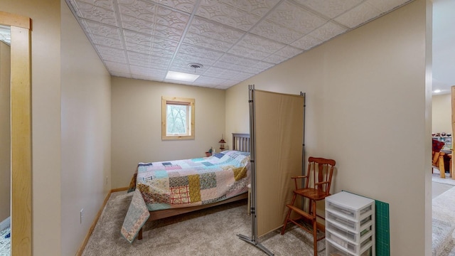 bedroom featuring carpet, visible vents, and baseboards