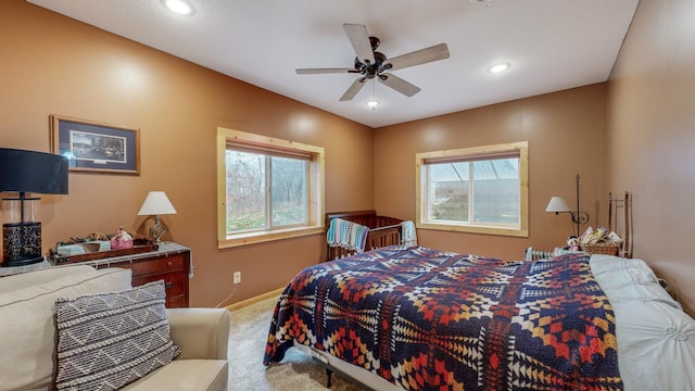 carpeted bedroom with ceiling fan, baseboards, and recessed lighting