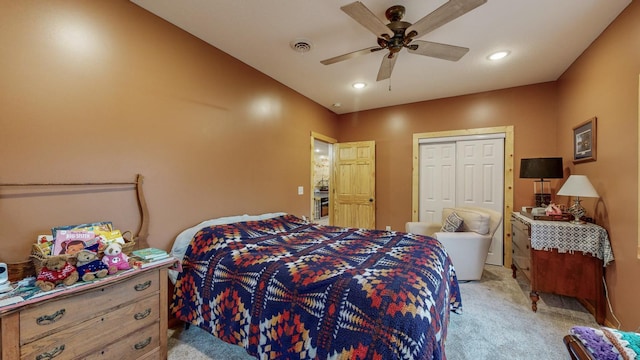 bedroom with recessed lighting, a closet, visible vents, light carpet, and ceiling fan