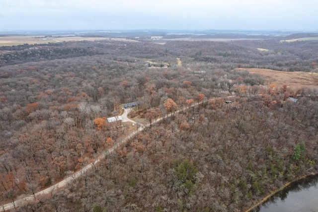 aerial view featuring a wooded view