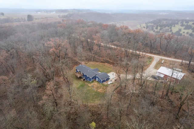 birds eye view of property with a rural view and a view of trees