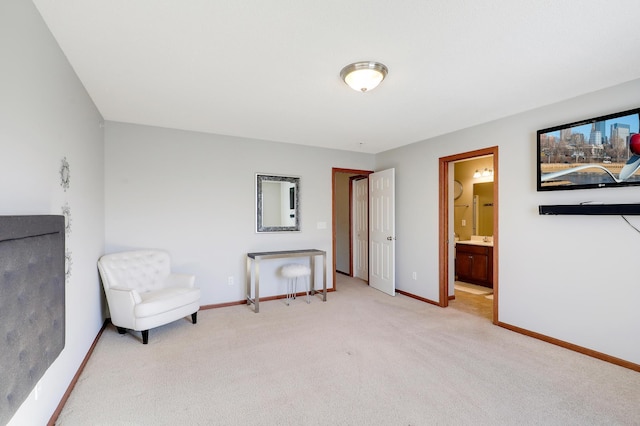 unfurnished room featuring light carpet and baseboards