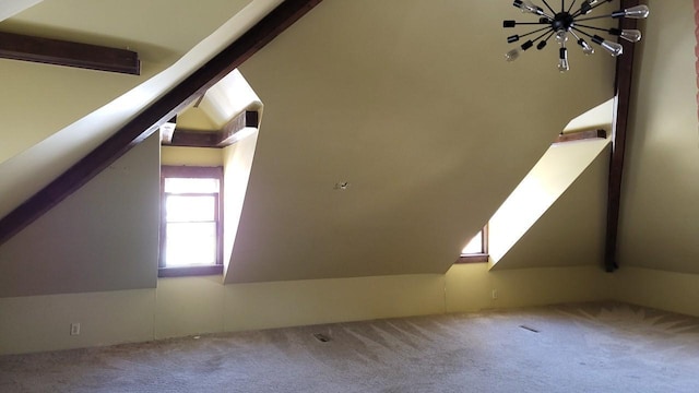 bonus room featuring lofted ceiling and carpet