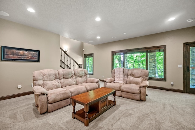 4350 Golfview Dr, Jordan, MN 55352 - living area with carpet flooring, recessed lighting, baseboards, a textured ceiling, and stairway