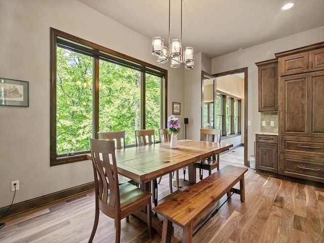 4350 Golfview Dr, Jordan, MN 55352 - dining area featuring light wood finished floors, a chandelier, baseboards, and recessed lighting