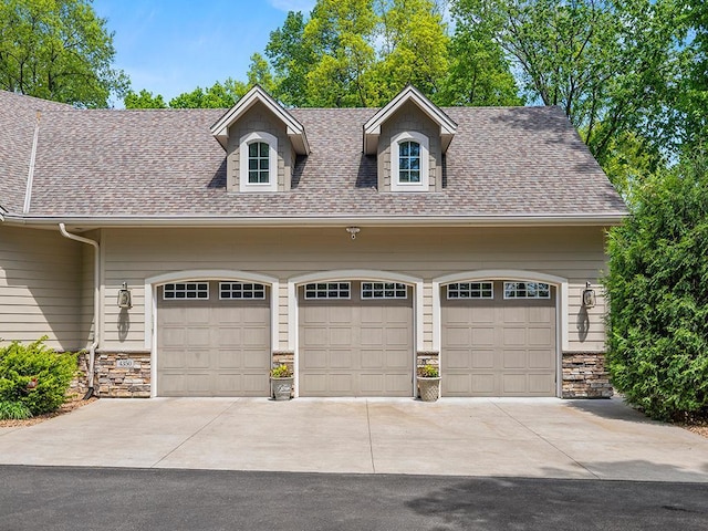 4350 Golfview Dr, Jordan, MN 55352 - view of front facade featuring driveway, stone siding, and roof with shingles