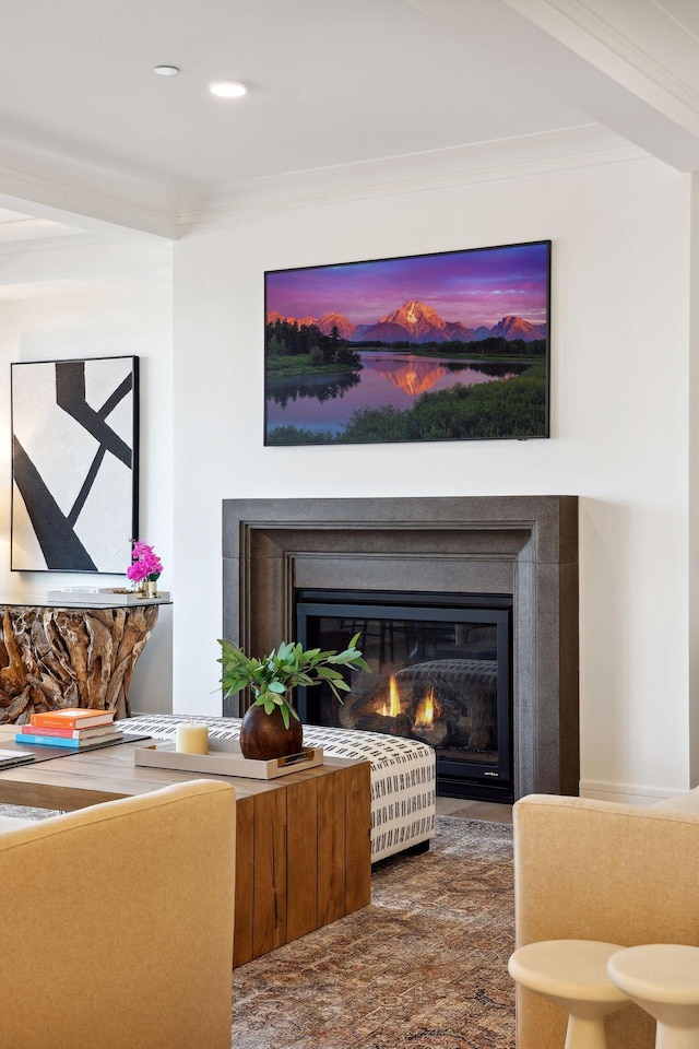 room details featuring recessed lighting, a glass covered fireplace, and crown molding