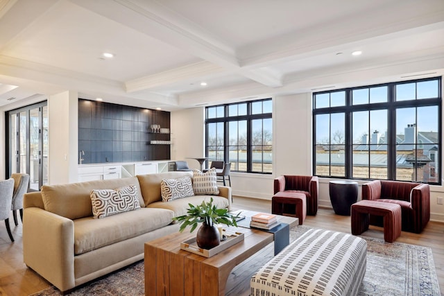 living area with recessed lighting, coffered ceiling, beam ceiling, and wood finished floors