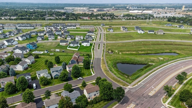 bird's eye view featuring a water view and a residential view