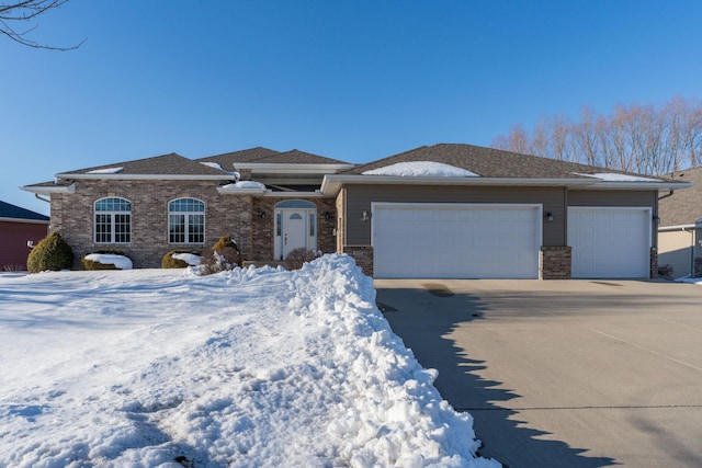 view of front facade featuring a garage, concrete driveway, and brick siding