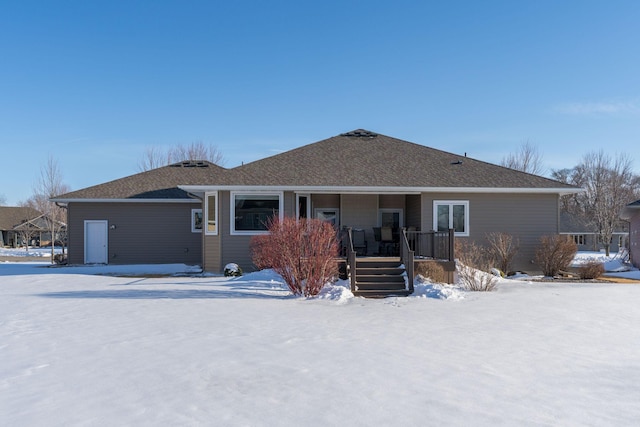 snow covered property featuring covered porch