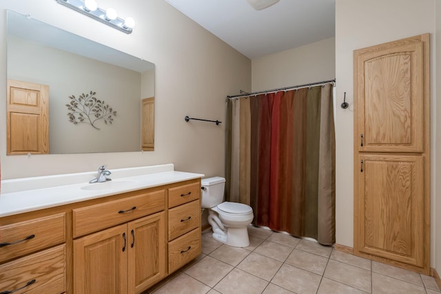 bathroom with toilet, tile patterned flooring, a shower with shower curtain, and vanity