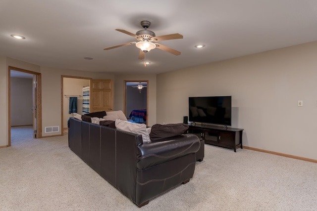 living room featuring recessed lighting, baseboards, visible vents, and light colored carpet