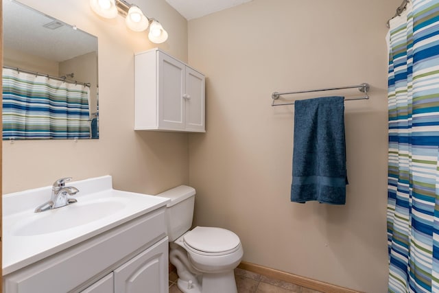 full bath with toilet, tile patterned flooring, baseboards, and vanity