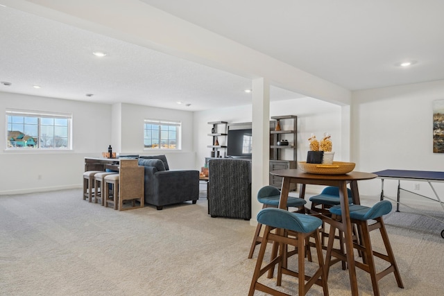 dining area featuring baseboards, a healthy amount of sunlight, recessed lighting, and light colored carpet