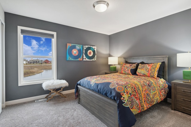 carpeted bedroom with baseboards