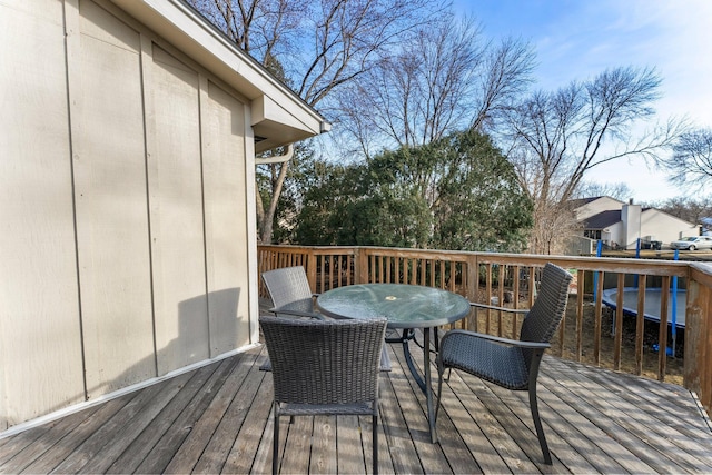 wooden deck with outdoor dining area