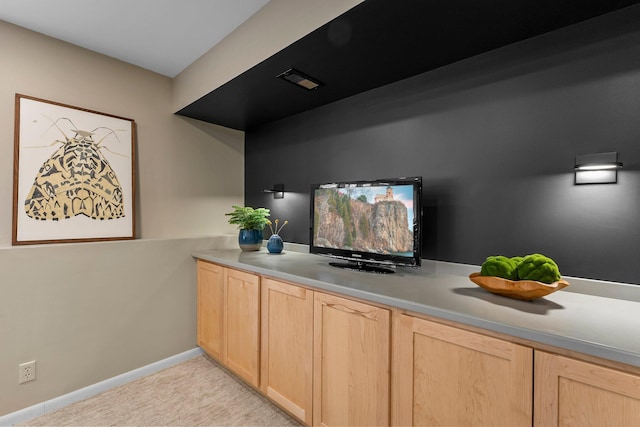 bar with light colored carpet and baseboards