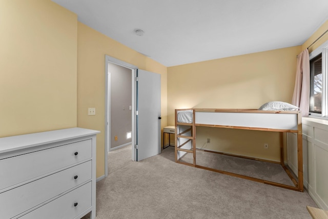 bedroom featuring light colored carpet