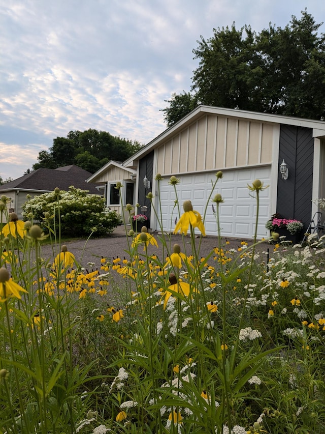 exterior space with a garage and board and batten siding