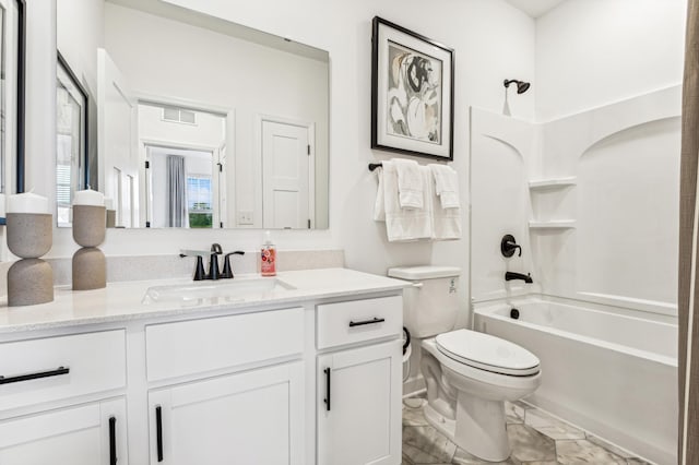 bathroom featuring visible vents, shower / tub combination, vanity, and toilet