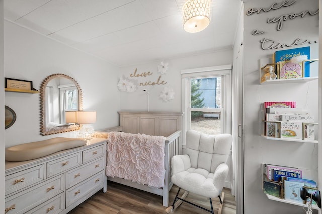 bedroom with wood finished floors