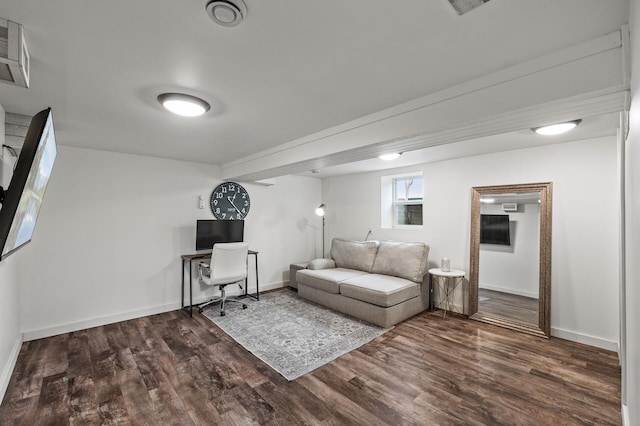 living room featuring dark wood-type flooring and baseboards