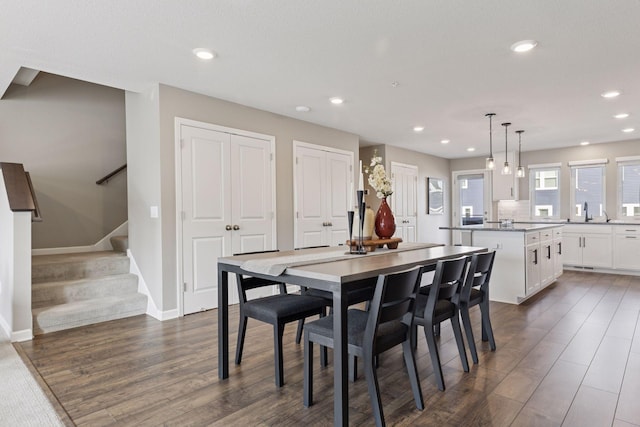 dining space featuring recessed lighting, stairway, baseboards, and dark wood-type flooring