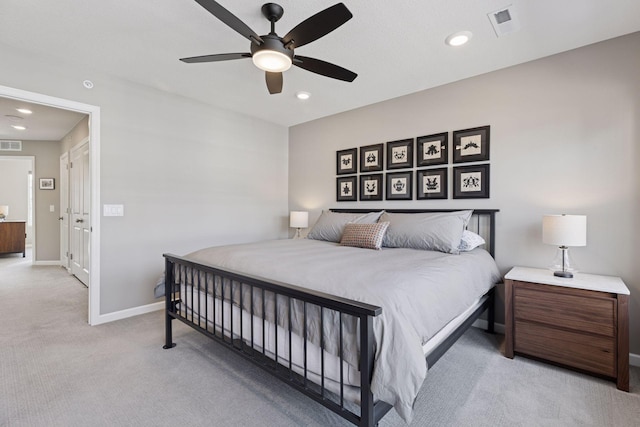 carpeted bedroom with a ceiling fan, recessed lighting, visible vents, and baseboards