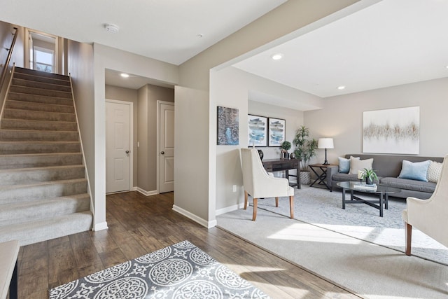 living room with recessed lighting, baseboards, wood finished floors, and stairs