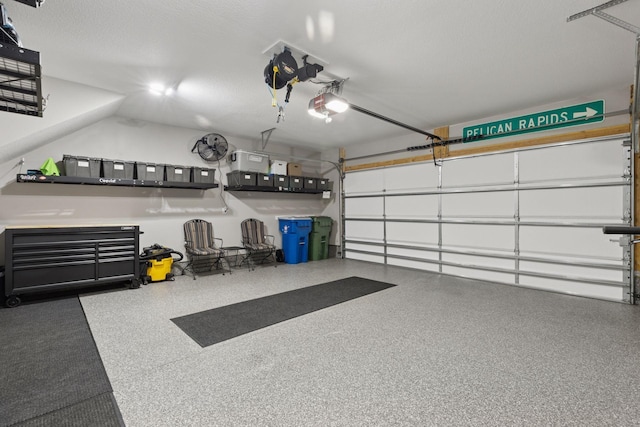 garage featuring a garage door opener