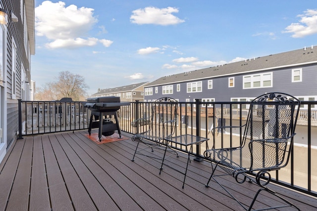 wooden terrace featuring a residential view