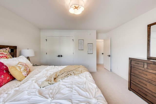 702 Summer Ave SE, New Prague, MN 56071 - bedroom with a closet, baseboards, and light colored carpet