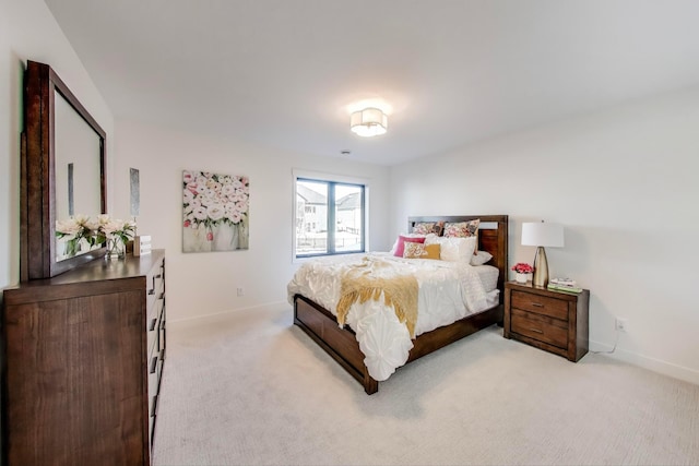 702 Summer Ave SE, New Prague, MN 56071 - bedroom with baseboards and light colored carpet