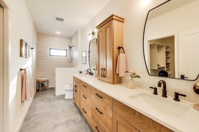 702 Summer Ave SE, New Prague, MN 56071 - full bath featuring toilet, walk in shower, visible vents, and a sink