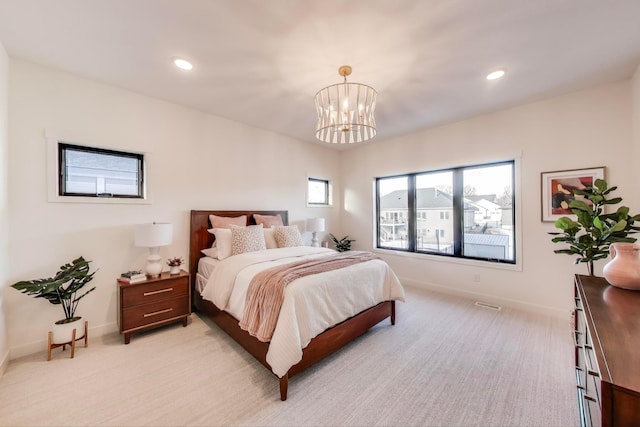 702 Summer Ave SE, New Prague, MN 56071 - bedroom with an inviting chandelier, recessed lighting, baseboards, and light carpet