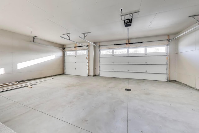 702 Summer Ave SE, New Prague, MN 56071 - garage featuring a garage door opener