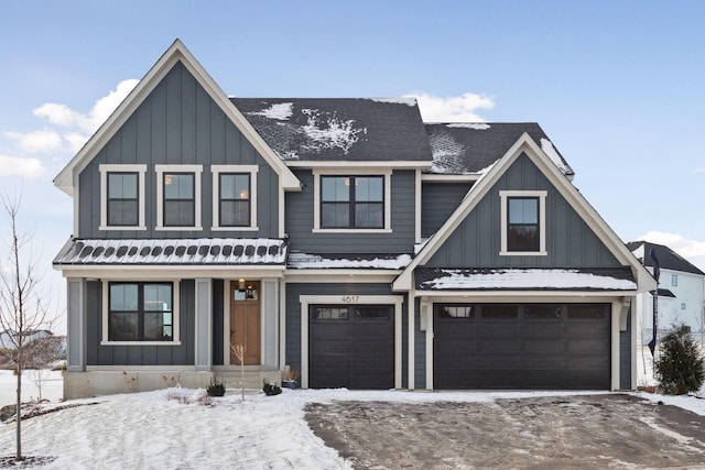 view of front facade with a garage and board and batten siding