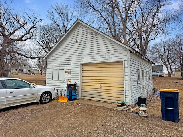 garage featuring driveway