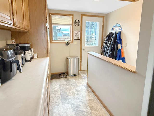 interior space featuring baseboards