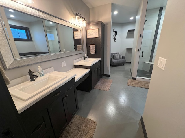 bathroom with a sink, two vanities, finished concrete flooring, and a shower stall