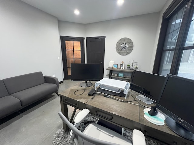 home office with recessed lighting and finished concrete flooring