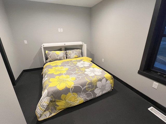 bedroom featuring carpet, baseboards, and visible vents