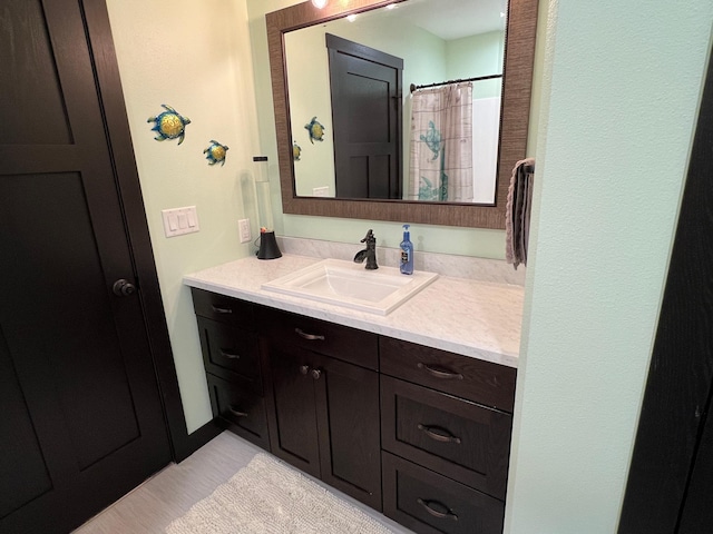 full bathroom featuring vanity