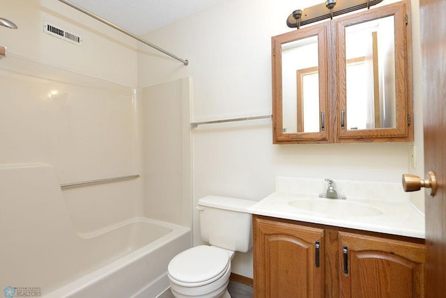 bathroom featuring washtub / shower combination, visible vents, vanity, and toilet