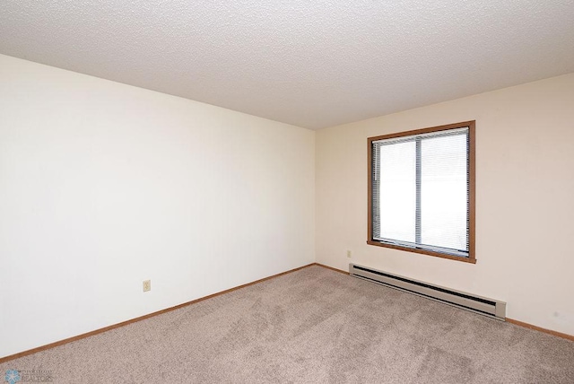 carpeted empty room with baseboards, a textured ceiling, and baseboard heating