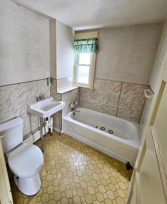 bathroom with toilet and tile patterned floors