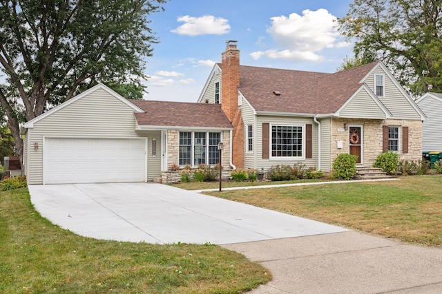 view of front of home featuring a front yard, a garage, stone siding, and a shingled roof