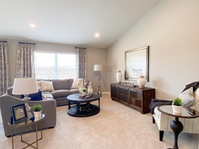 carpeted living room with baseboards, vaulted ceiling, and recessed lighting