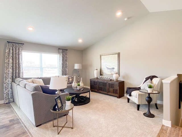 living room with lofted ceiling, baseboards, wood finished floors, and recessed lighting